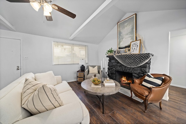 living area with ceiling fan, a fireplace, baseboards, vaulted ceiling, and dark wood finished floors