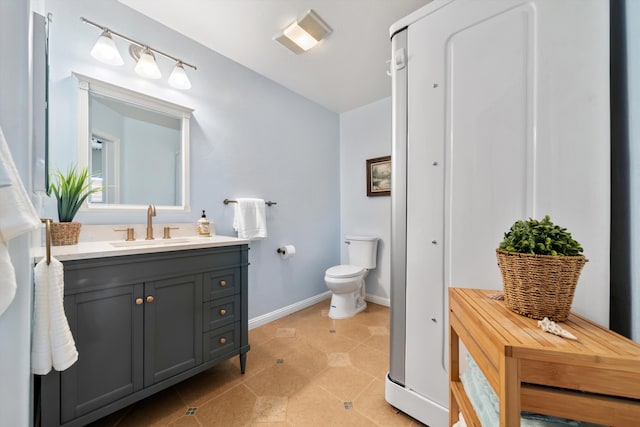 23831 Lakeview Dr, Tehachapi, CA 93561 - bathroom featuring toilet, vanity, and baseboards