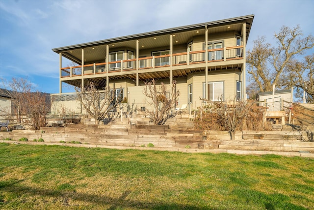 23831 Lakeview Dr, Tehachapi, CA 93561 - back of house featuring a balcony and a lawn