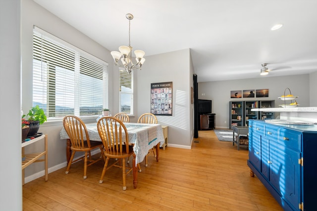 23831 Lakeview Dr, Tehachapi, CA 93561 - dining area with a chandelier, light wood finished floors, and baseboards