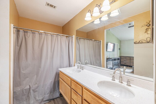 bathroom with hardwood / wood-style floors and vanity