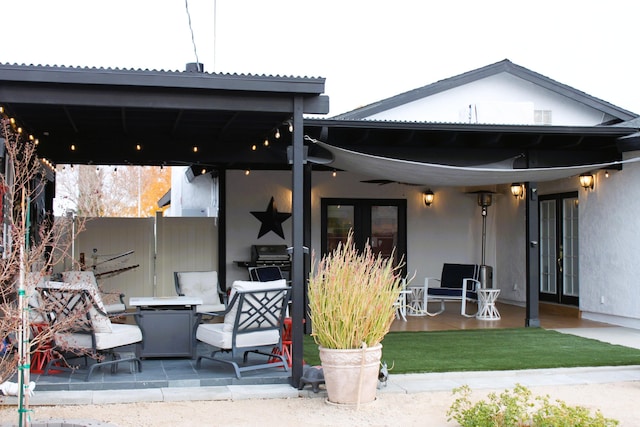 rear view of property featuring a patio area and french doors