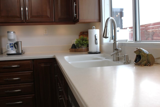 kitchen featuring sink and dark brown cabinetry