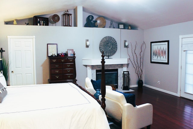 bedroom with dark hardwood / wood-style floors and vaulted ceiling