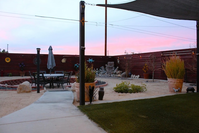 yard at dusk with a patio