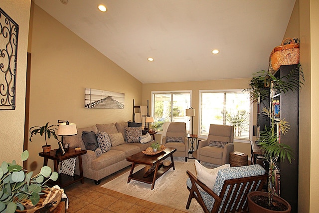 tiled living area with vaulted ceiling and recessed lighting