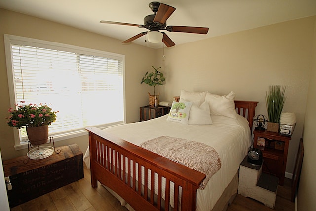 bedroom featuring wood finished floors and a ceiling fan