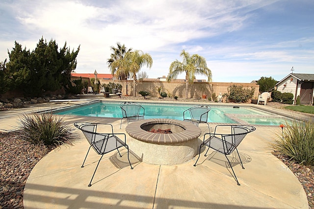 view of pool featuring a fenced backyard, a fenced in pool, an in ground hot tub, and a patio