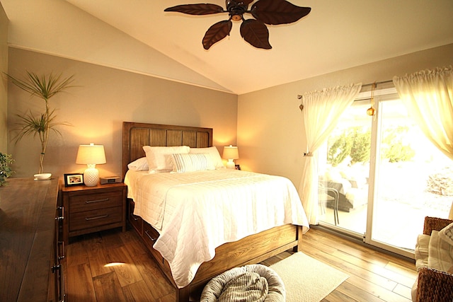 bedroom featuring vaulted ceiling, hardwood / wood-style flooring, ceiling fan, and access to outside