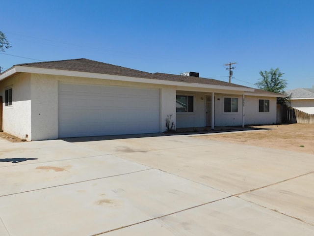 ranch-style house featuring a garage