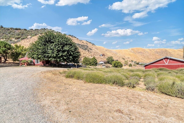 view of mountain feature with a rural view