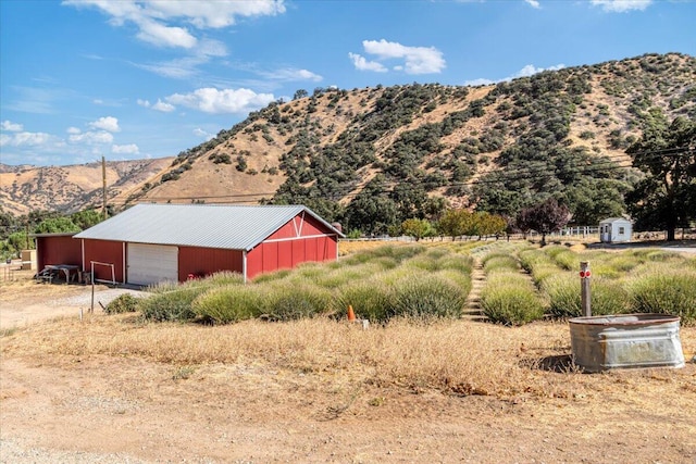 view of mountain feature with a rural view