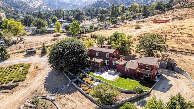 aerial view with a mountain view and a rural view