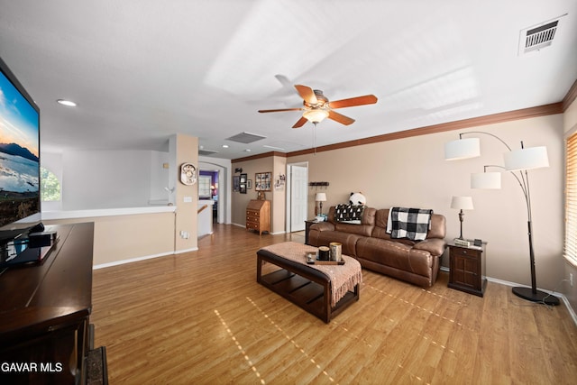 37331 E 57th St, Palmdale, CA 93552 - living room with light wood-style floors, ceiling fan, crown molding, and recessed lighting