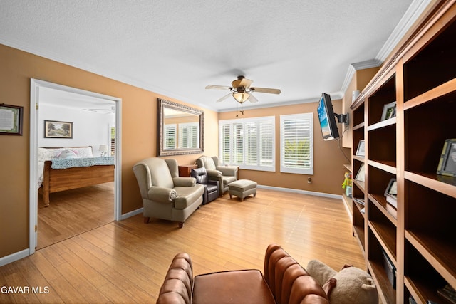 37331 E 57th St, Palmdale, CA 93552 - living room with crown molding, ceiling fan, light wood-style floors, and a textured ceiling