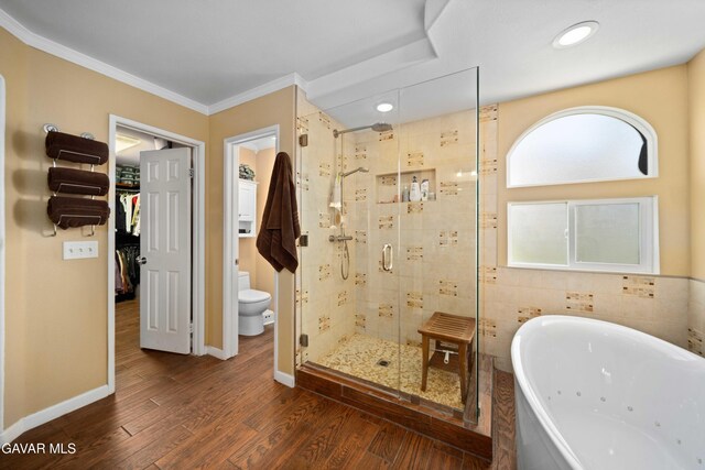 37331 E 57th St, Palmdale, CA 93552 - bathroom featuring a tub with jets, a shower stall, wood finished floors, crown molding, and a walk in closet