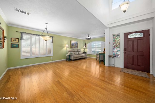 37331 E 57th St, Palmdale, CA 93552 - foyer featuring light wood finished floors and crown molding