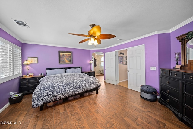 37331 E 57th St, Palmdale, CA 93552 - bedroom with wood finished floors, a ceiling fan, ornamental molding, and arched walkways