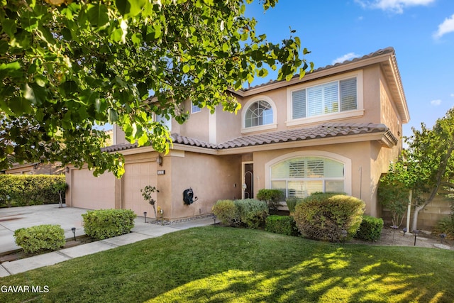 37331 E 57th St, Palmdale, CA 93552 - mediterranean / spanish home with stucco siding, a front yard, and concrete driveway