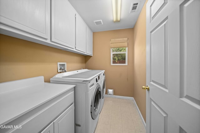 37331 E 57th St, Palmdale, CA 93552 - laundry room featuring cabinet space, washing machine and dryer, and light tile patterned floors