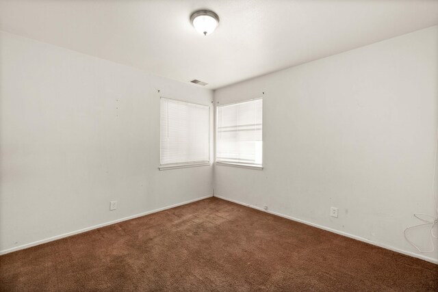 empty room featuring carpet