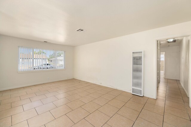 empty room with light tile patterned flooring