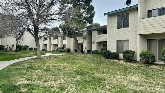 view of community featuring a lawn