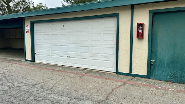 garage featuring a carport