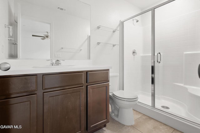 6116 Commonwealth Ave, Bakersfield, CA 93313 - bathroom with a stall shower, vanity, tile patterned floors, and a ceiling fan