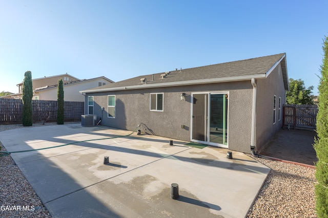 6116 Commonwealth Ave, Bakersfield, CA 93313 - rear view of property featuring stucco siding, a fenced backyard, and a patio area