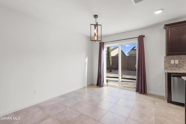 6116 Commonwealth Ave, Bakersfield, CA 93313 - unfurnished dining area with light tile patterned floors and recessed lighting