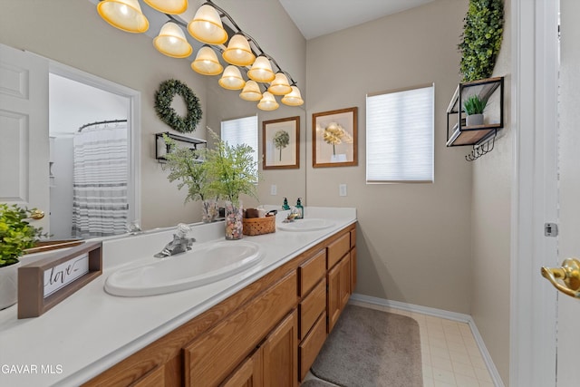 4148 Sungate Dr, Palmdale, CA 93551 - bathroom featuring double vanity and healthy amount of natural light