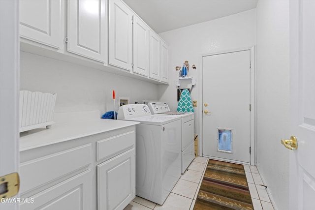 4148 Sungate Dr, Palmdale, CA 93551 - laundry room featuring washing machine and dryer, cabinet space, and light tile patterned flooring