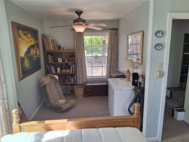 laundry area with ceiling fan and light colored carpet