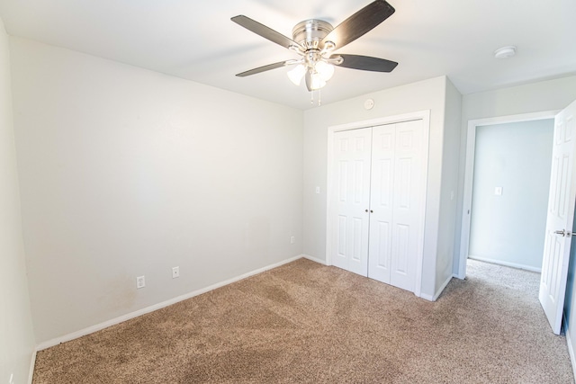 unfurnished bedroom featuring carpet flooring, ceiling fan, and a closet