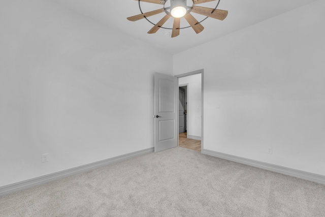 empty room with light carpet and ceiling fan