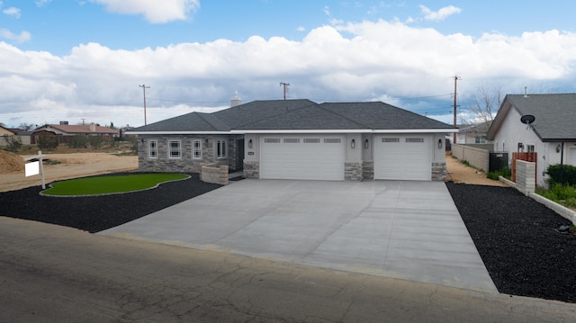 view of front facade featuring a garage and a front lawn