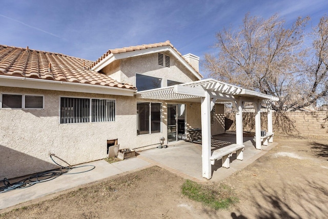 back of house featuring a pergola and a patio