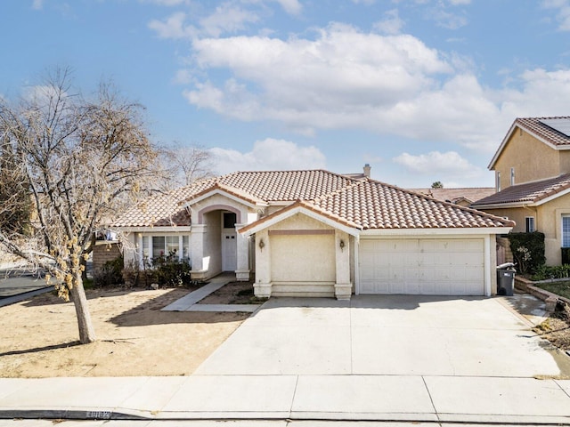 mediterranean / spanish house with a garage