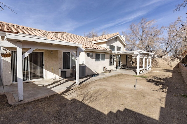 back of house featuring a patio, cooling unit, and a pergola