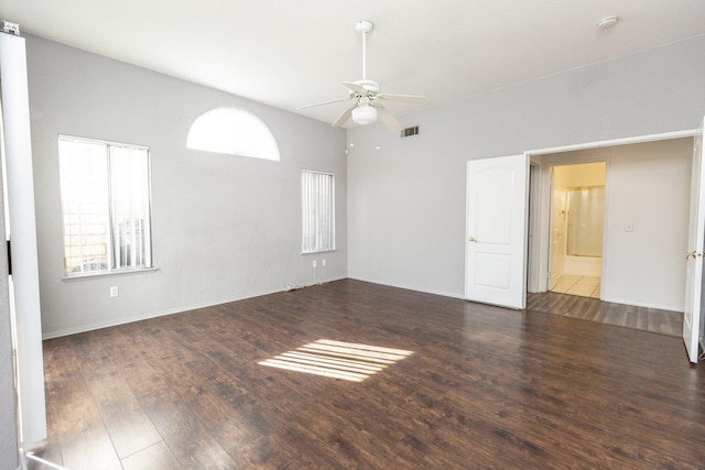 spare room featuring dark hardwood / wood-style flooring and ceiling fan