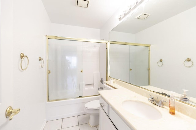 full bathroom with vanity, tile patterned flooring, enclosed tub / shower combo, and toilet