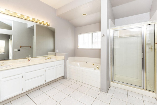 bathroom featuring vanity, tile patterned floors, and plus walk in shower