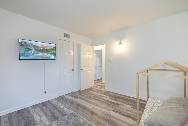 interior space featuring hardwood / wood-style floors and a closet