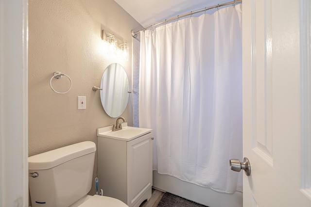 full bathroom with vanity, toilet, and shower / bath combo with shower curtain