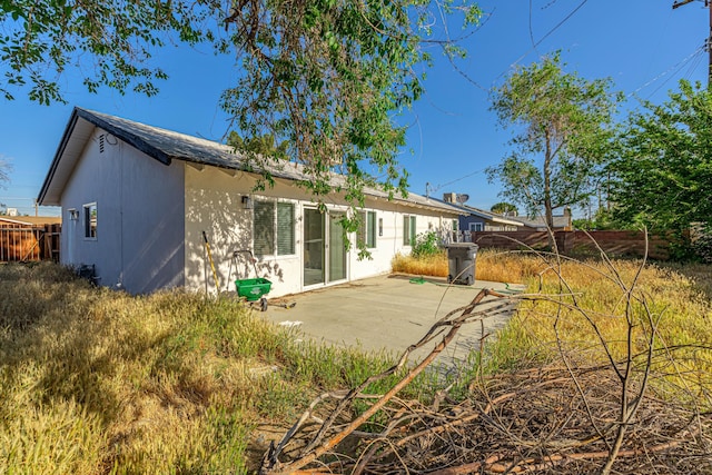 back of house with a patio area