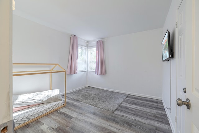 unfurnished bedroom featuring hardwood / wood-style flooring