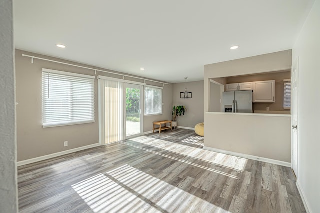 unfurnished living room featuring light wood-type flooring