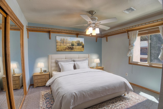 carpeted bedroom featuring ceiling fan