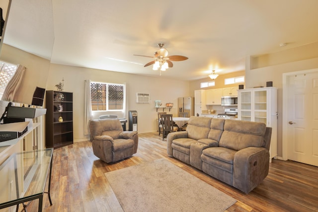 living room with ceiling fan and light hardwood / wood-style flooring